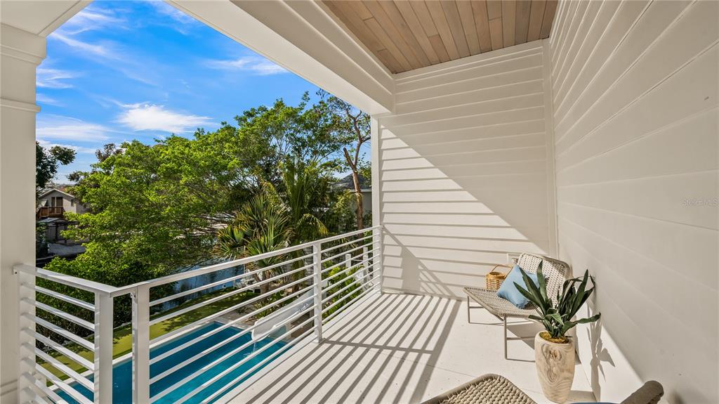 6536 Peacock Road Sarasota, FL 34242 - Photo 39 of 82 a view of balcony with wooden floor and fence