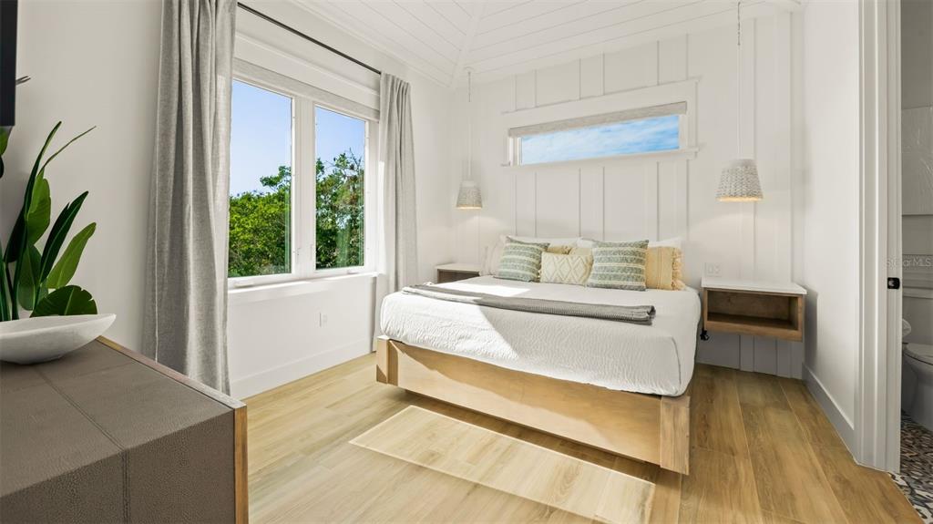 6536 Peacock Road Sarasota, FL 34242 - Photo 44 of 82 a bedroom with a bed and a window