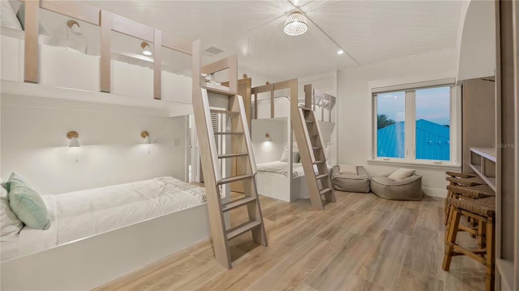 6536 Peacock Road Sarasota, FL 34242 - Photo 50 of 82 a living room with furniture and a wooden floor