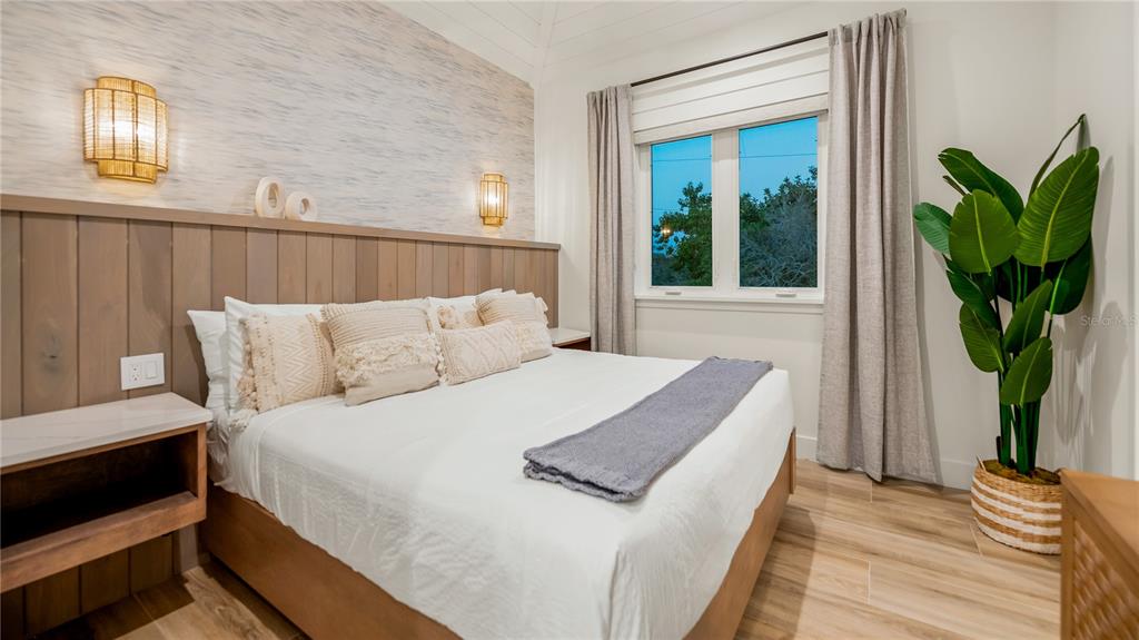 6536 Peacock Road Sarasota, FL 34242 - Photo 56 of 82 a bed sitting in a bedroom next to a window