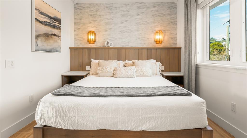 6536 Peacock Road Sarasota, FL 34242 - Photo 57 of 82 a bedroom with a bed and a window