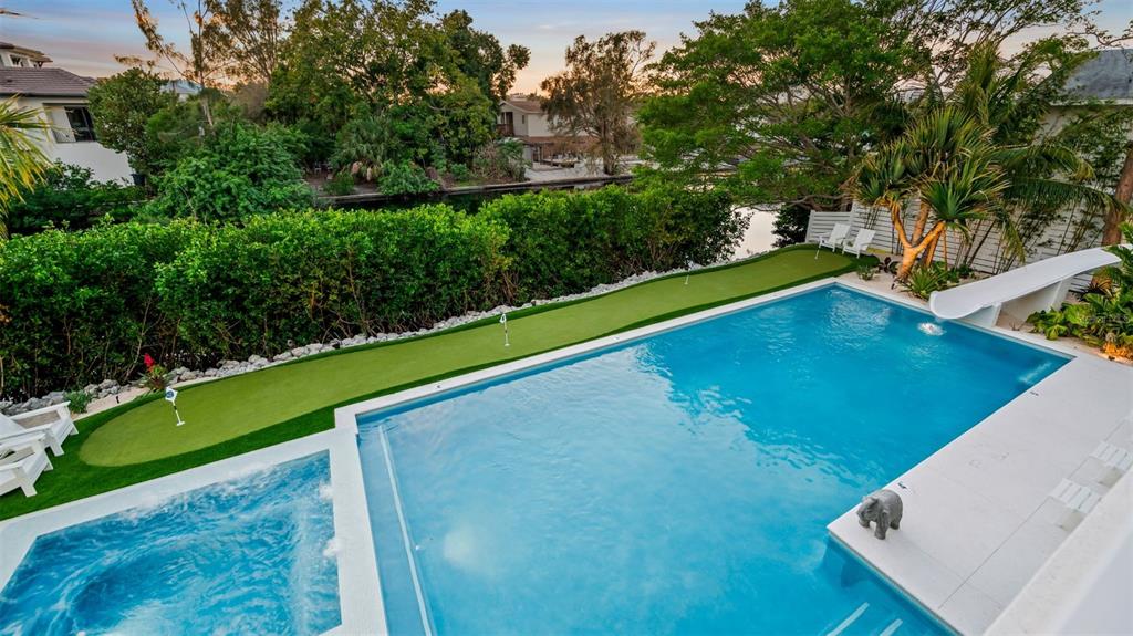 6536 Peacock Road Sarasota, FL 34242 - Photo 72 of 82 a view of a mini pool with an outdoor space and seating area
