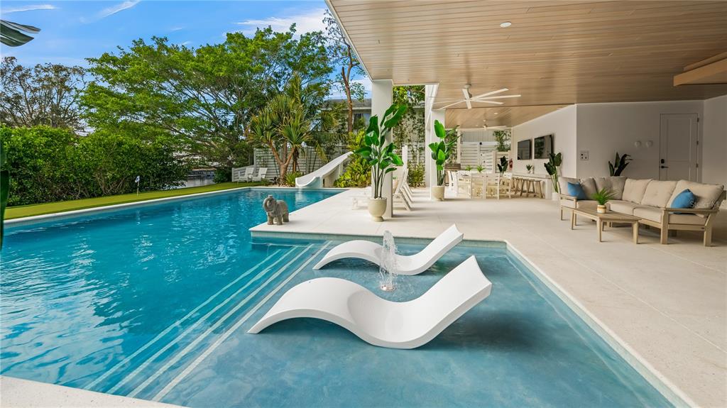 6536 Peacock Road Sarasota, FL 34242 - Photo 73 of 82 a view of swimming pool with outdoor seating and plants