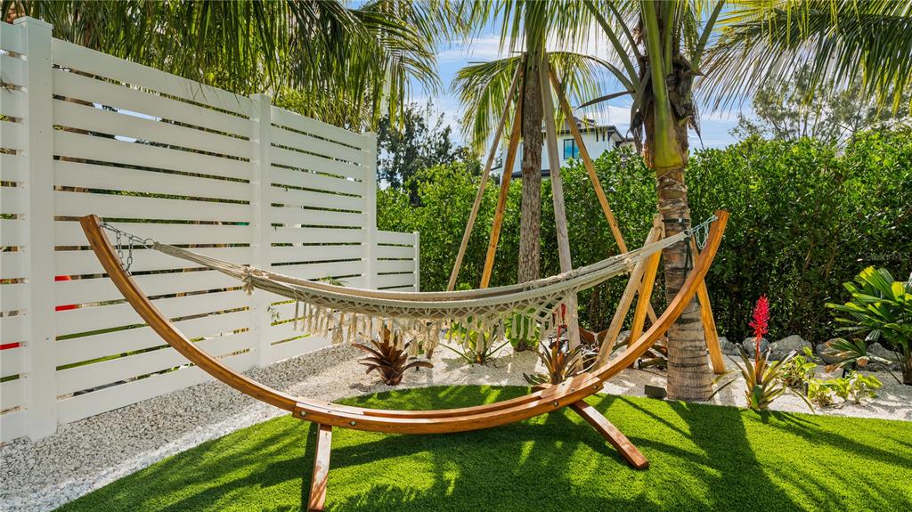6536 Peacock Road Sarasota, FL 34242 - Photo 75 of 82 a view of swimming pool with a garden and plants