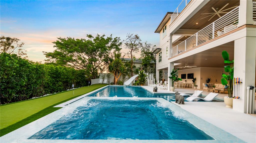 6536 Peacock Road Sarasota, FL 34242 - Photo 78 of 82 a view of backyard with swimming pool and seating space
