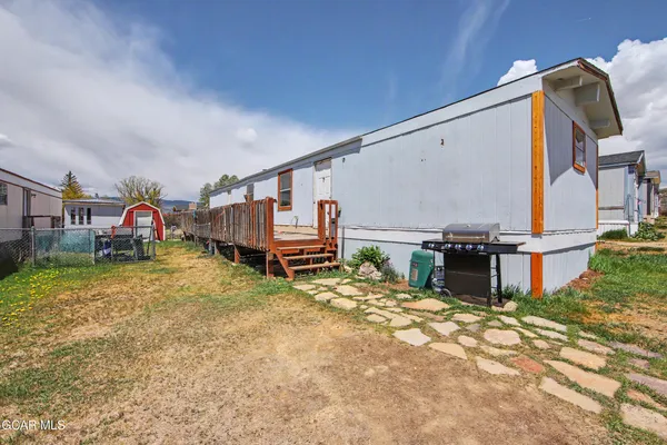 a house view with a backyard space