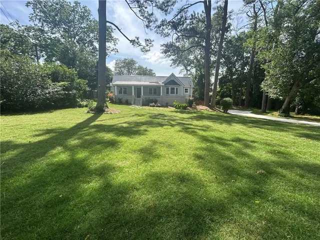 a garden view with a fountain