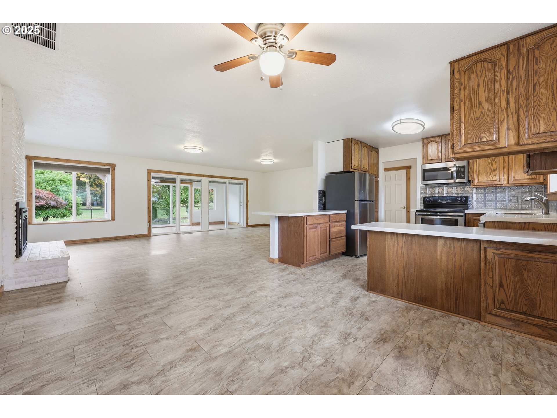 1920 Northeast View Court Gresham, OR 97030 - Photo 16 of 48 a open kitchen with cabinets stove and a refrigerator