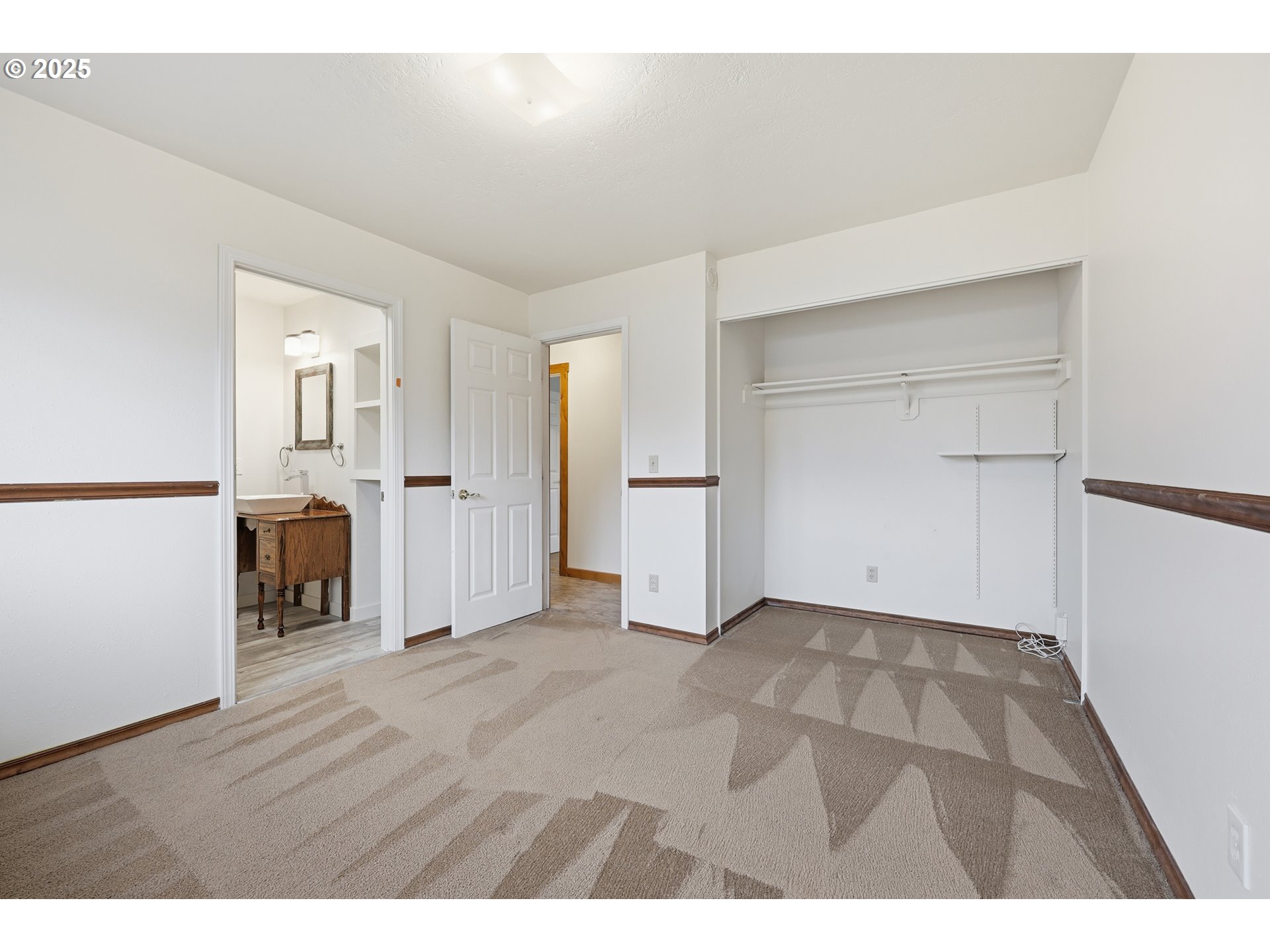 1920 Northeast View Court Gresham, OR 97030 - Photo 21 of 48 a view of an empty room with wooden floor