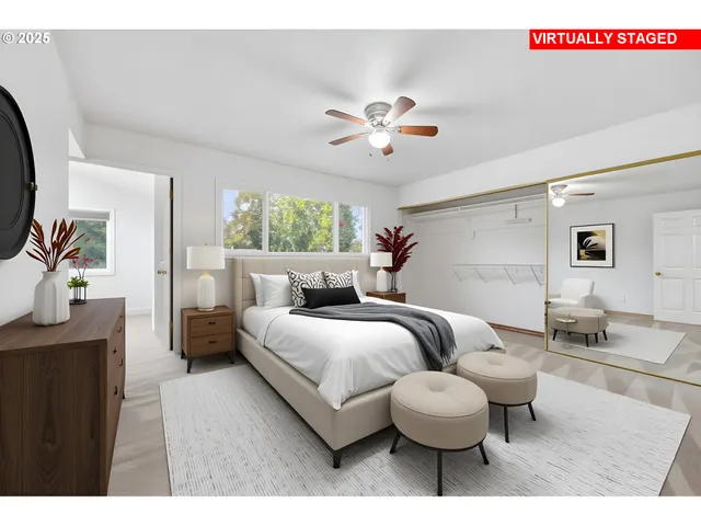 a living room with furniture and a large mirror