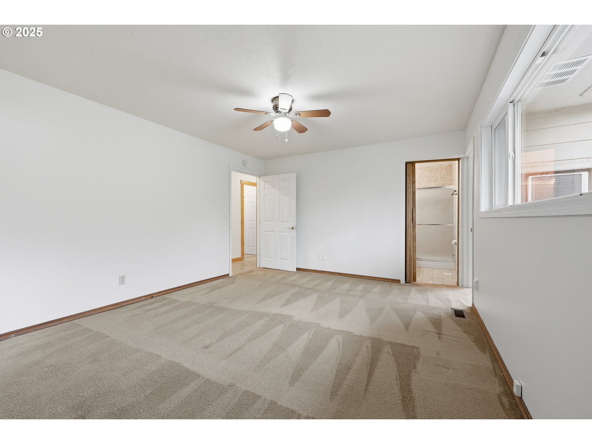 1920 Northeast View Court Gresham, OR 97030 - Photo 27 of 48 a view of an empty room with chandelier fan