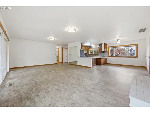 a view of kitchen and livingroom with furniture