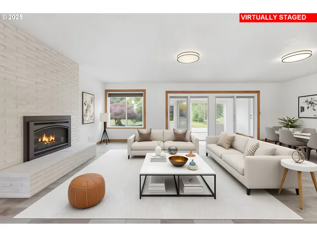 a living room with furniture a rug and a fireplace
