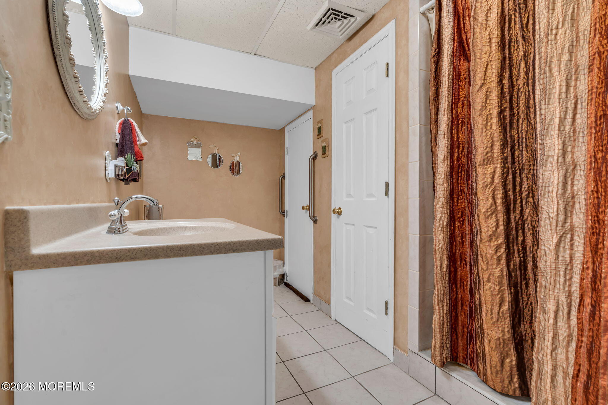 21 Ryan Road Marlboro, NJ 07746 - Photo 33 of 56 a bathroom with a sink and a mirror