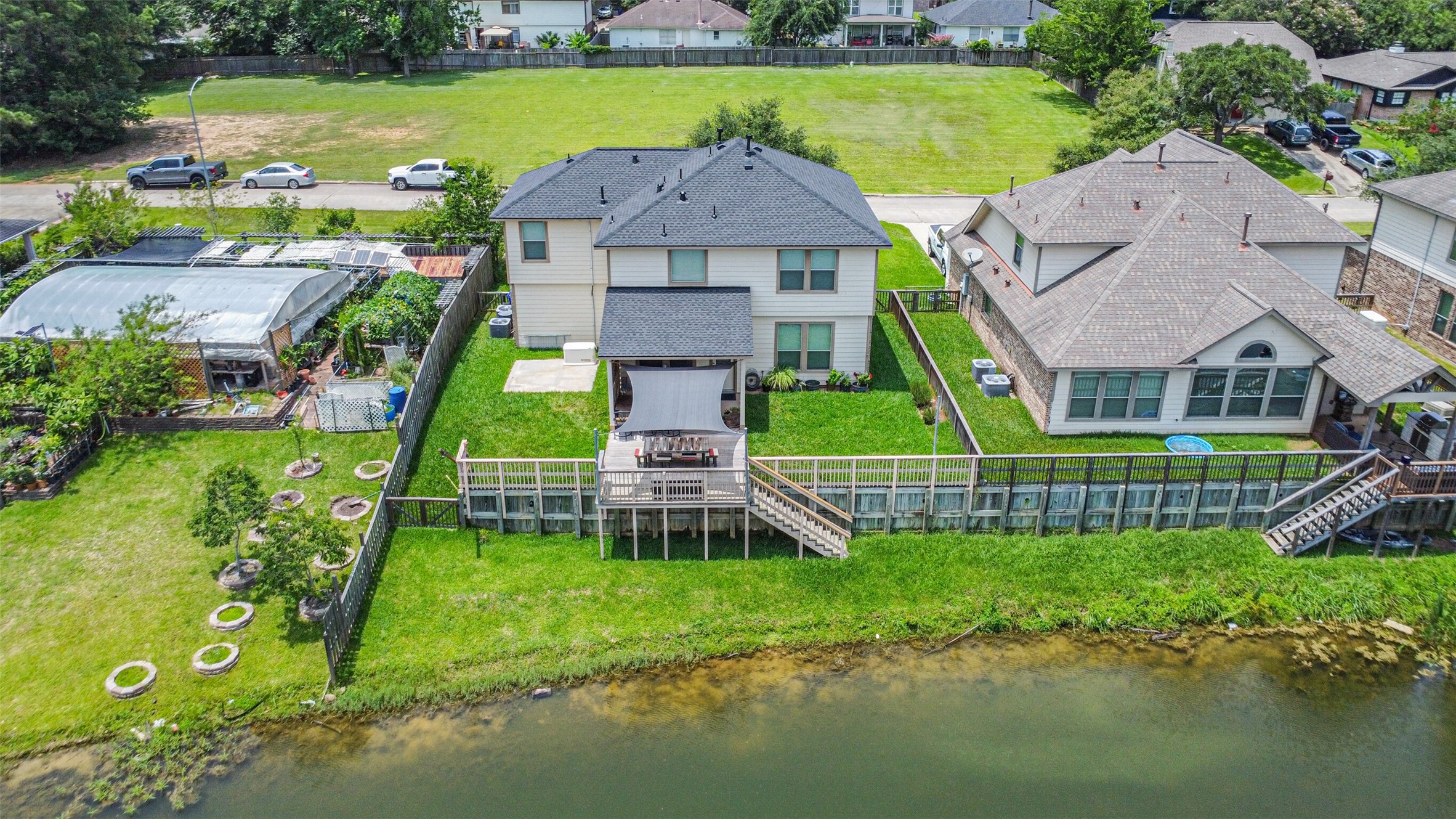 12009 La Salle River Road Conroe, TX 77304 - Photo 37 of 50 a aerial view of a house with a big yard and potted plants