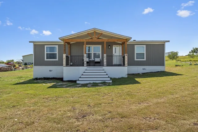 a view of a house with a swimming pool