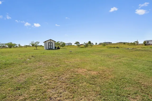 a view of an ocean and a yard