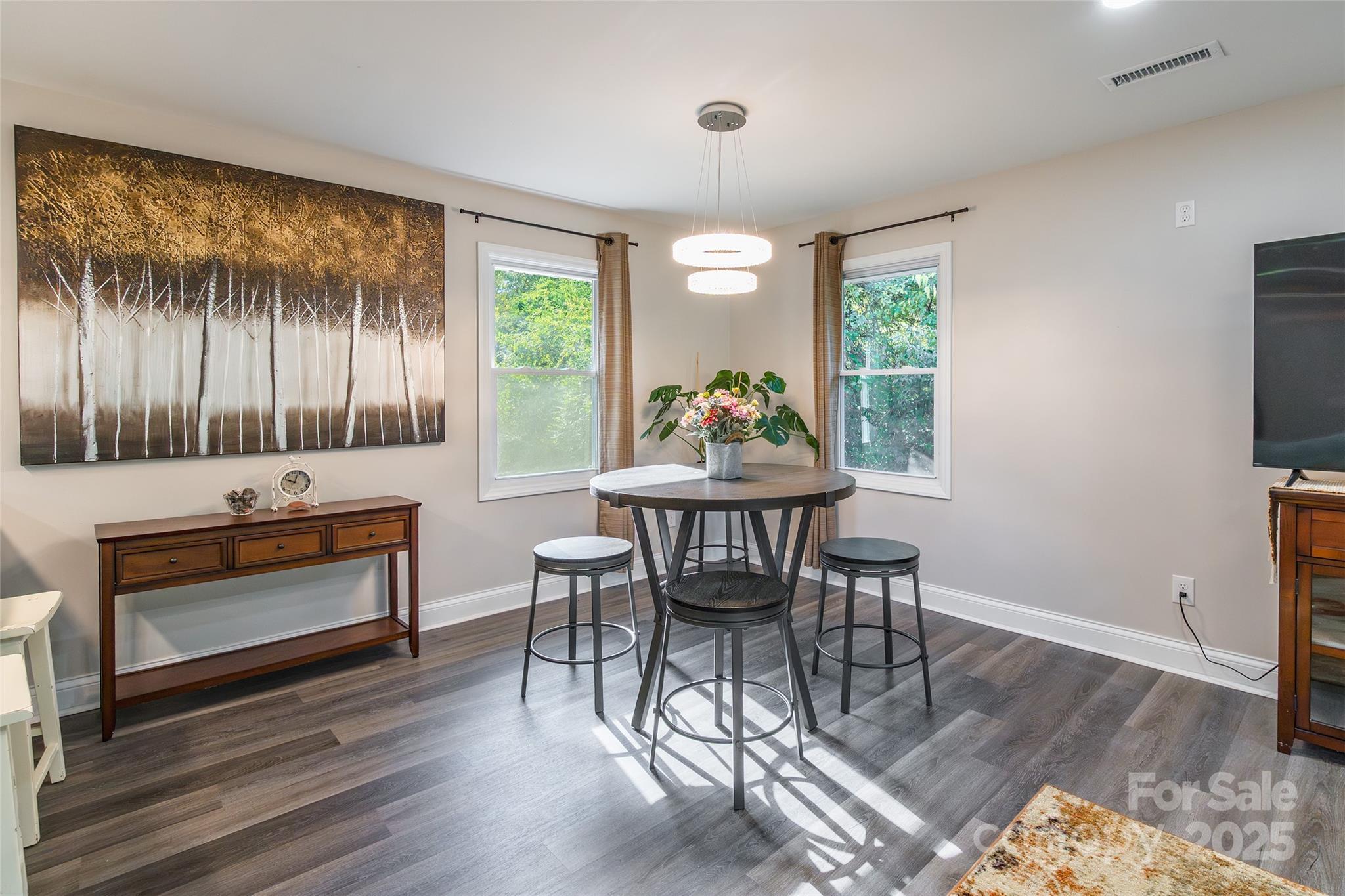 749 Meadowbrook Road Chester, SC 29706 - Photo 13 of 33 a dining room with furniture and wooden floor
