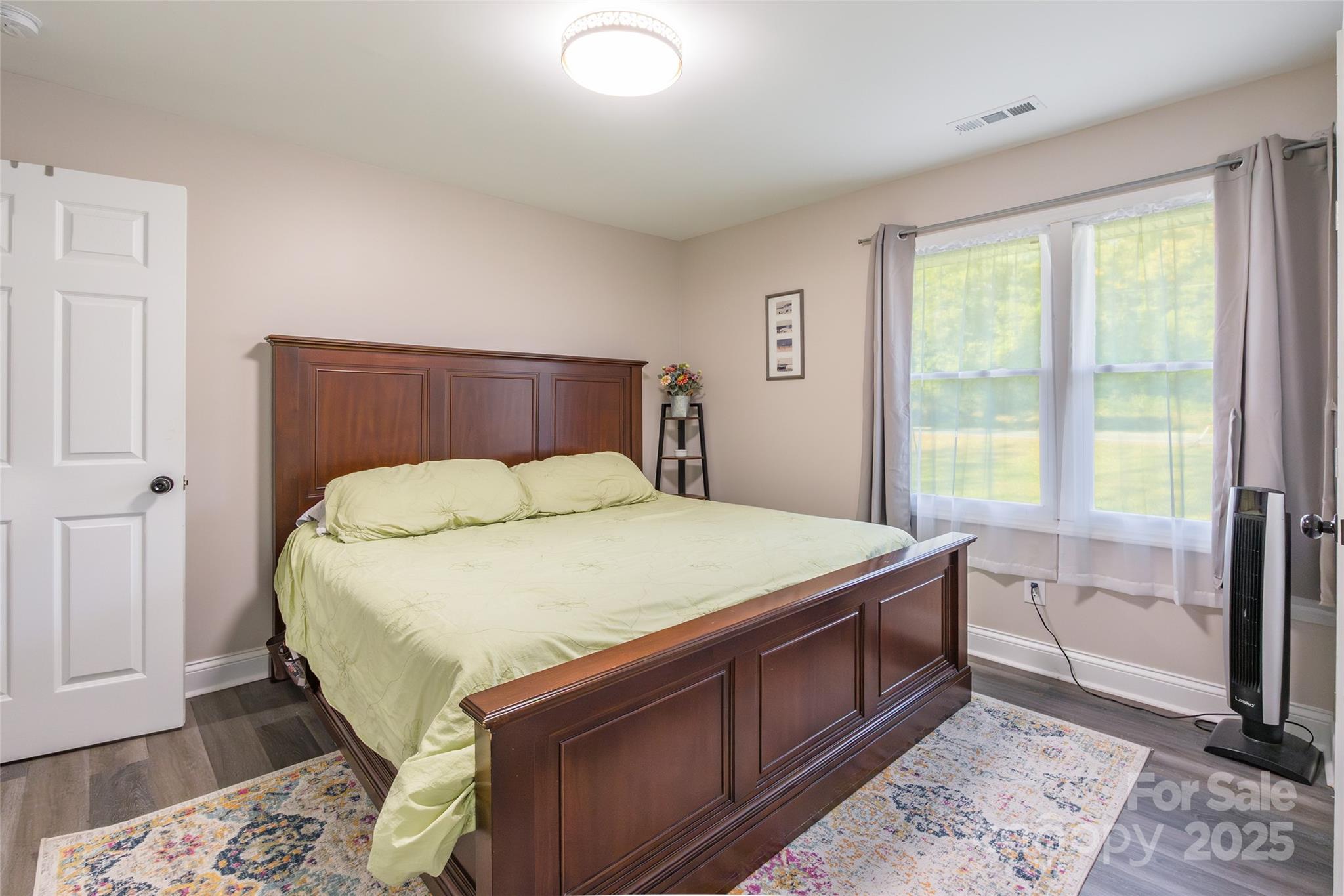 749 Meadowbrook Road Chester, SC 29706 - Photo 15 of 33 a bed sitting in a bedroom next to a window