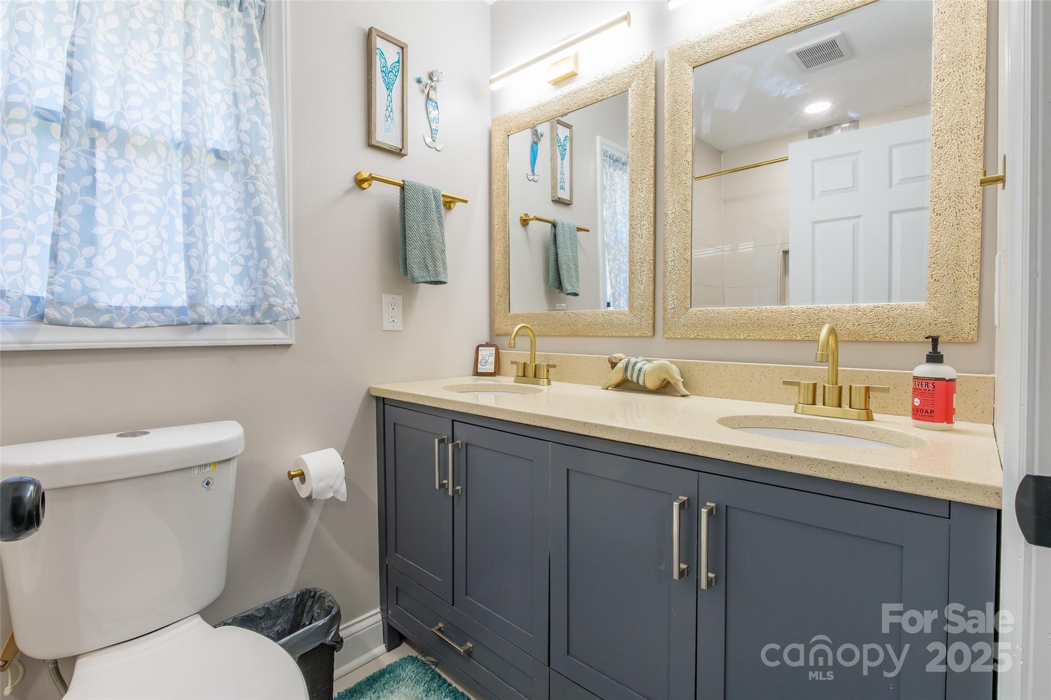 749 Meadowbrook Road Chester, SC 29706 - Photo 16 of 33 a bathroom with a toilet sink and mirror
