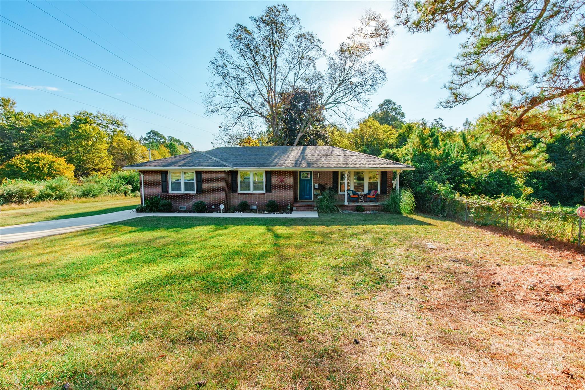 749 Meadowbrook Road Chester, SC 29706 - Photo 2 of 33 a front view of a house with a garden