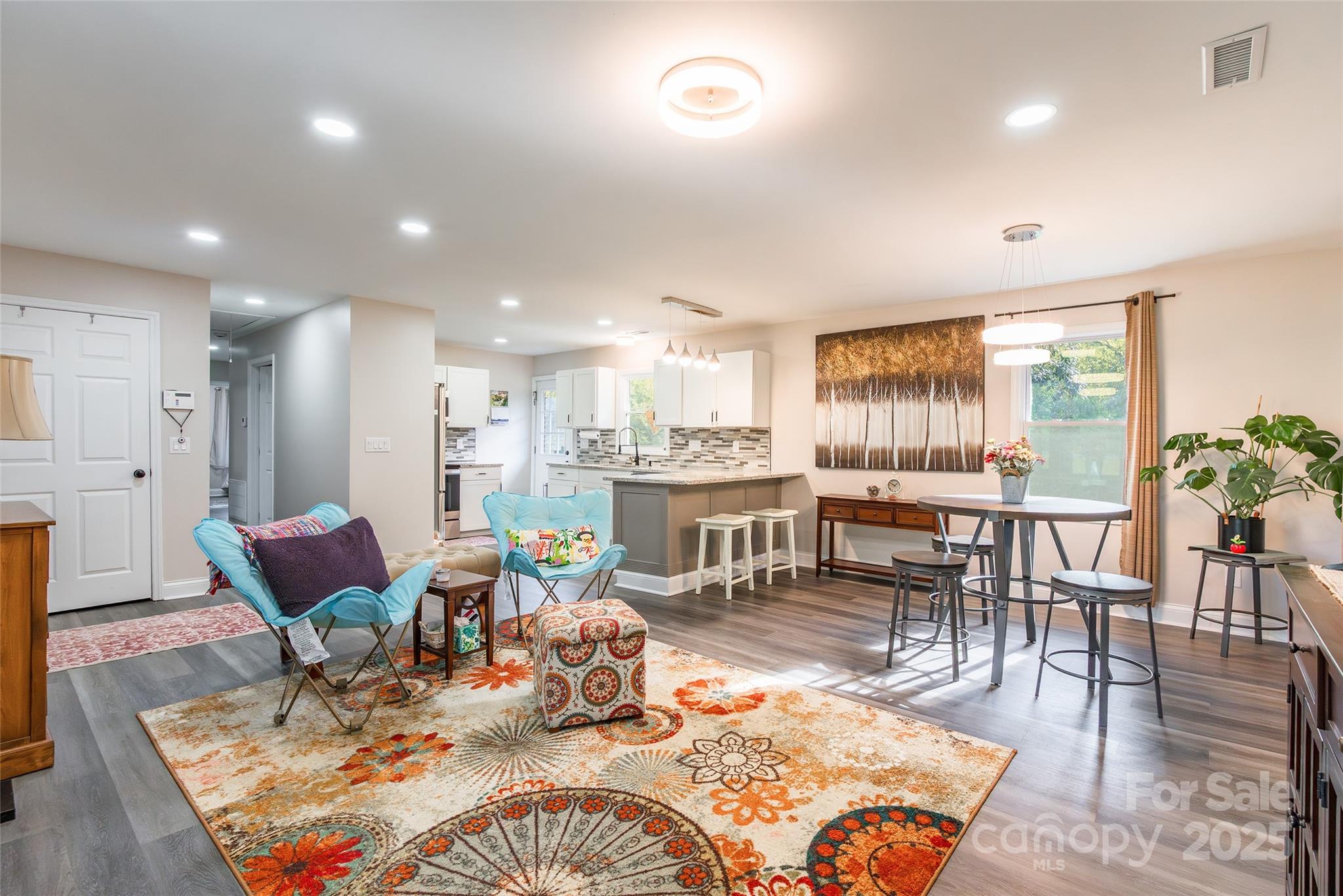 749 Meadowbrook Road Chester, SC 29706 - Photo 8 of 33 a living room with furniture a rug kitchen view and a large window