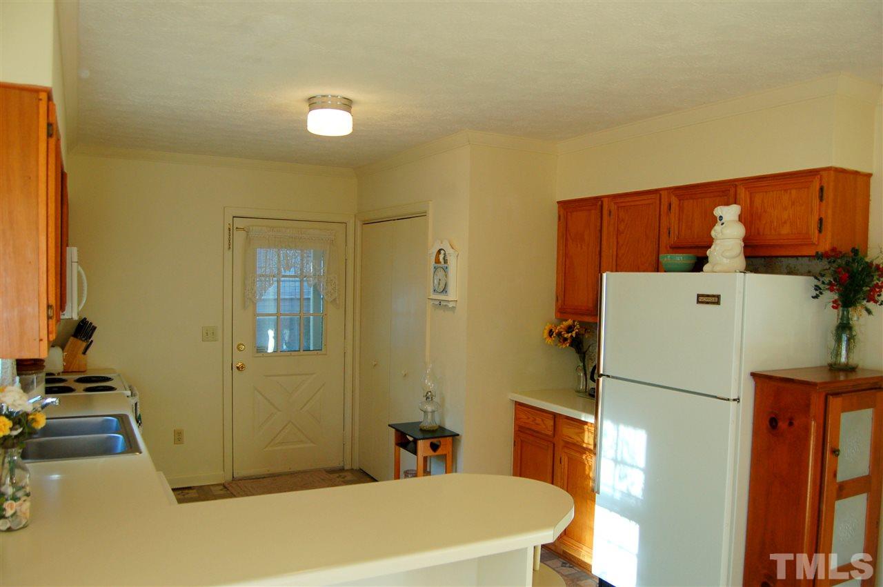 6109 Russell Road Durham, NC 27712 - Photo 11 of 25 a bathroom with a sink a toilet and shower