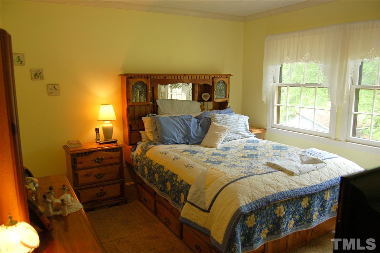 6109 Russell Road Durham, NC 27712 - Photo 13 of 25 a bedroom with a bed and a window