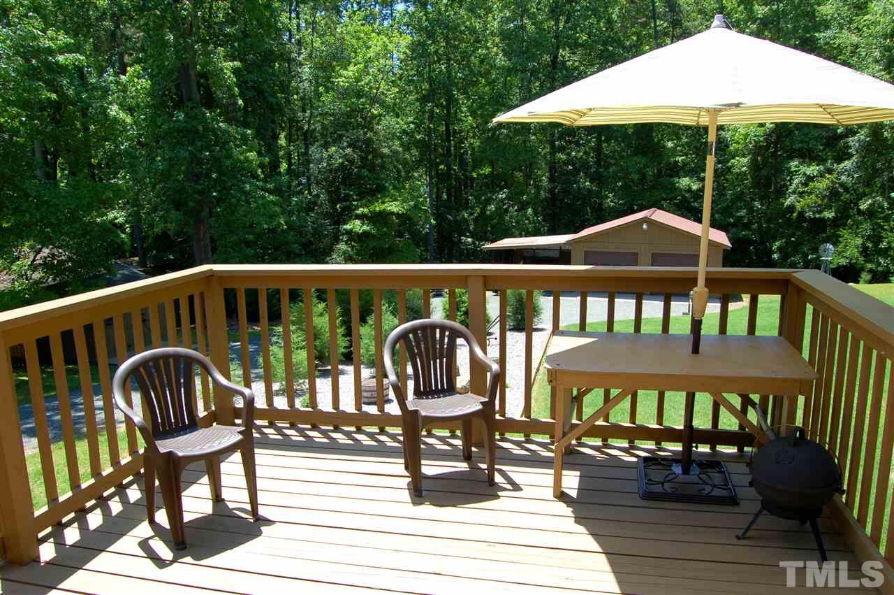 6109 Russell Road Durham, NC 27712 - Photo 17 of 25 a view of a chair and table on the deck