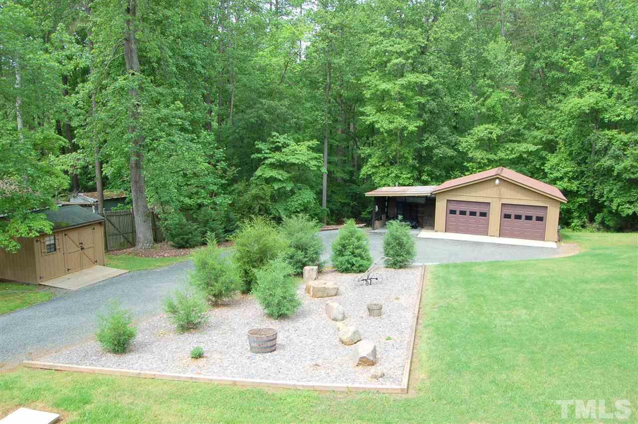 6109 Russell Road Durham, NC 27712 - Photo 18 of 25 a front view of a house with a yard