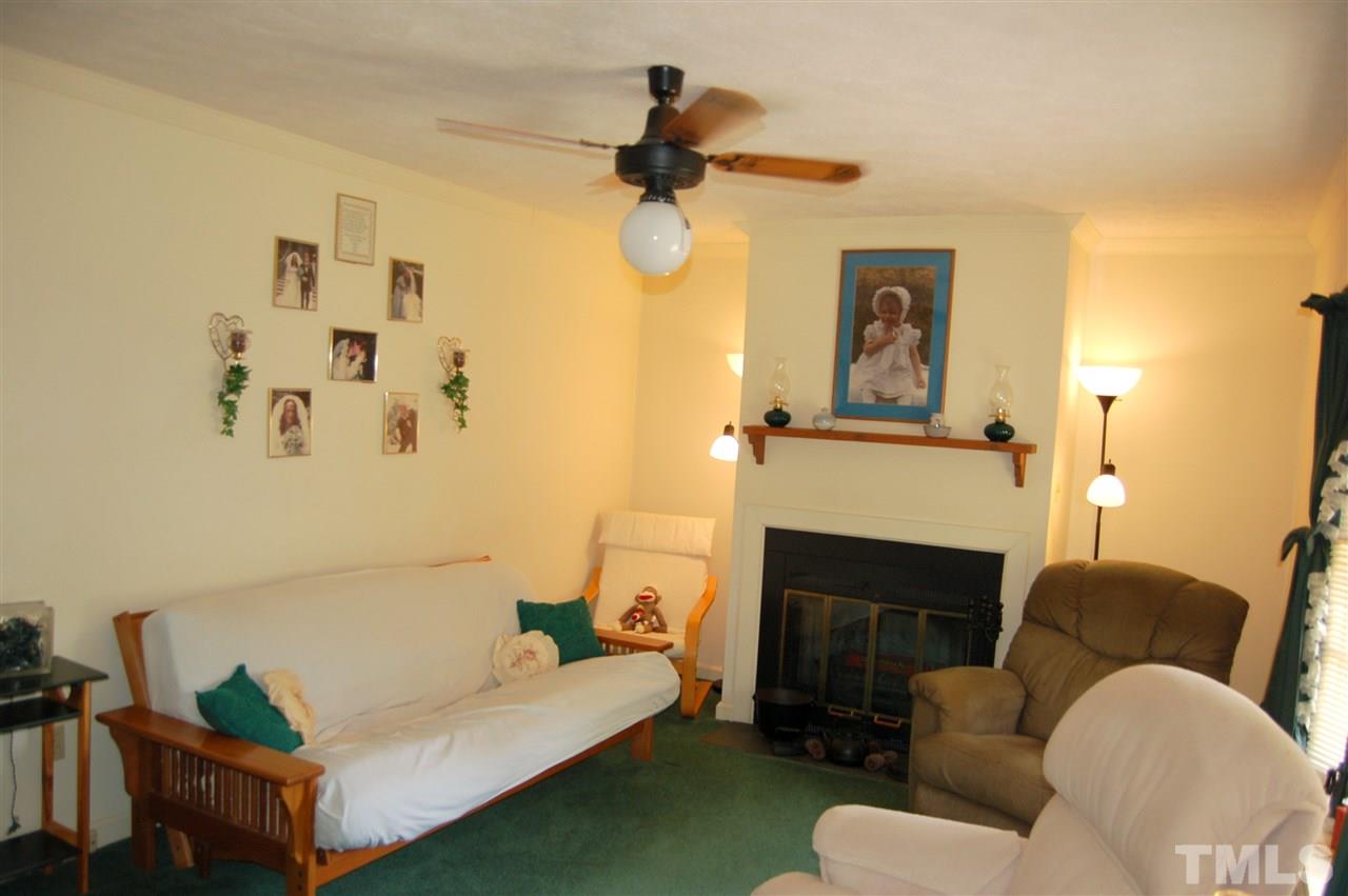 6109 Russell Road Durham, NC 27712 - Photo 3 of 25 a living room with furniture and a fireplace