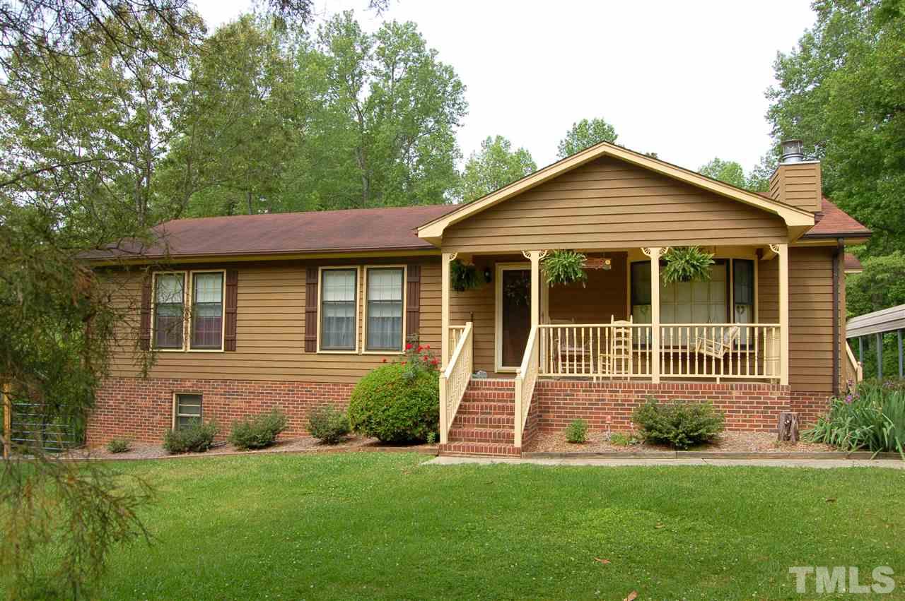 6109 Russell Road Durham, NC 27712 - Photo 25 of 25 a front view of a house with a yard