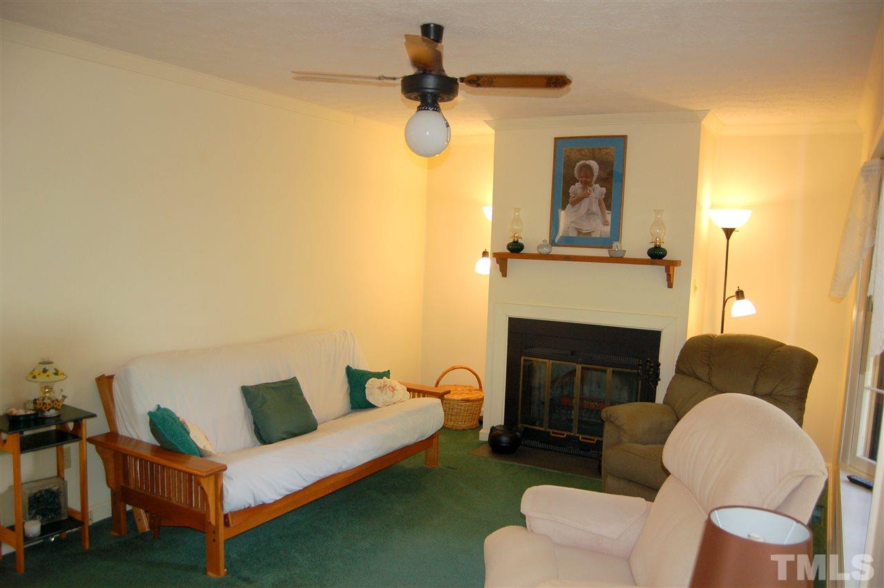 6109 Russell Road Durham, NC 27712 - Photo 5 of 25 a living room with furniture and a fireplace