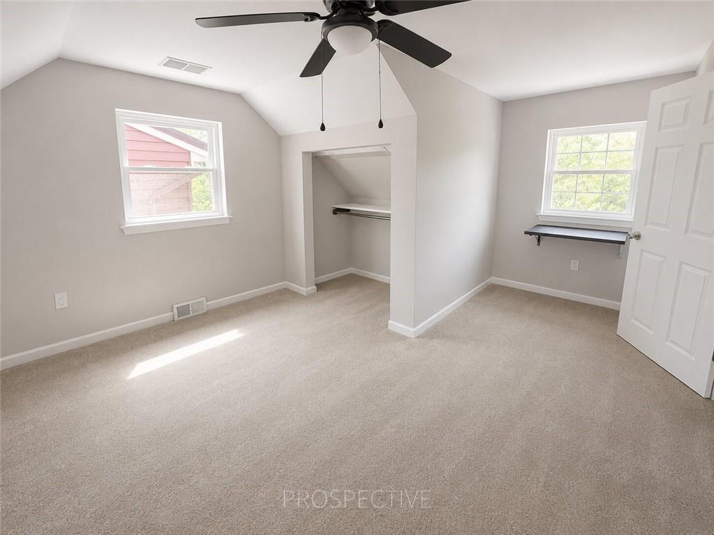 3079 Mt Troy Road Pittsburgh, PA 15212 - Photo 19 of 30 an empty room with a ceiling fan and a window