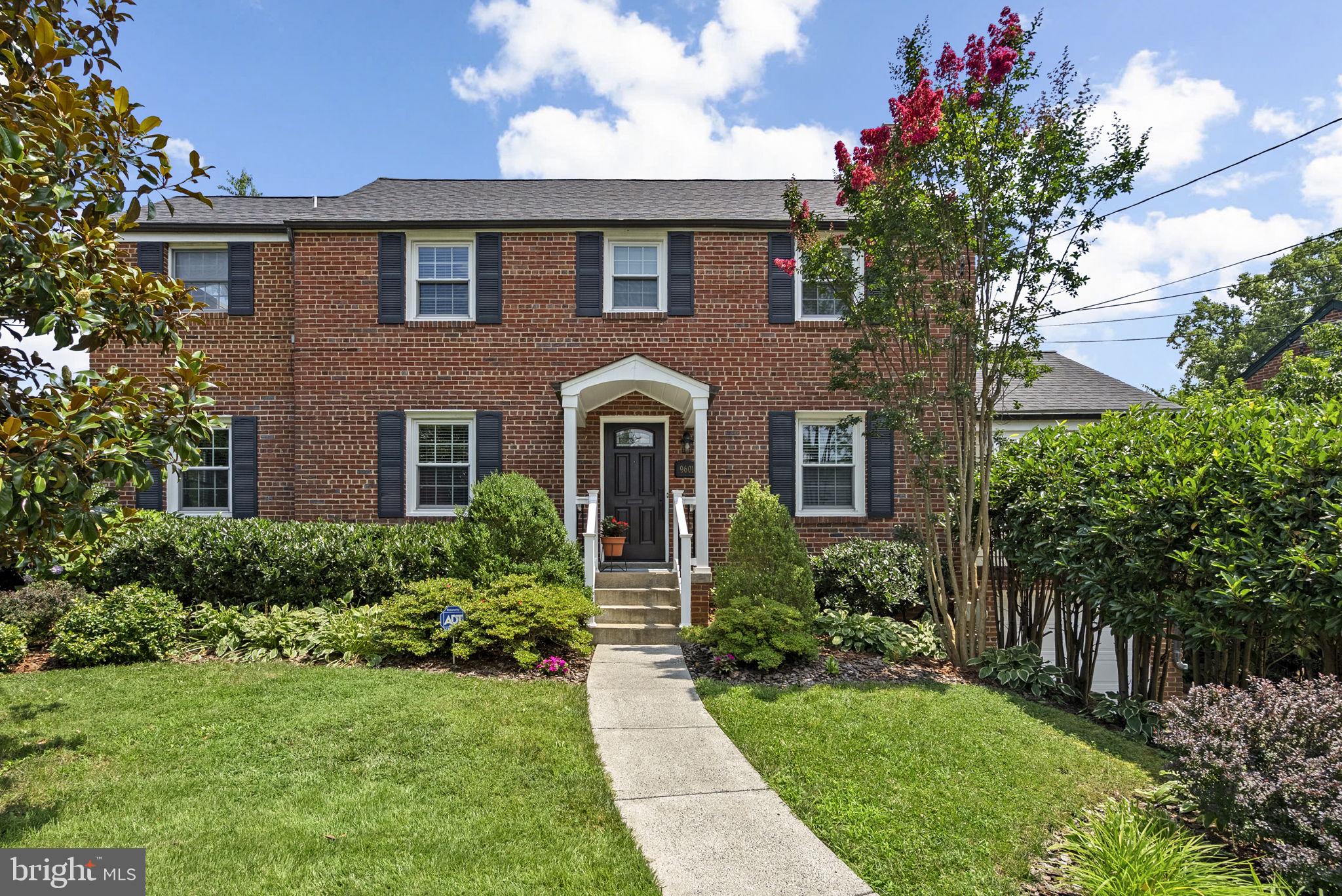 9601 Sutherland Road Silver Spring, MD 20901 - Photo 1 of 48 a front view of a house with garden