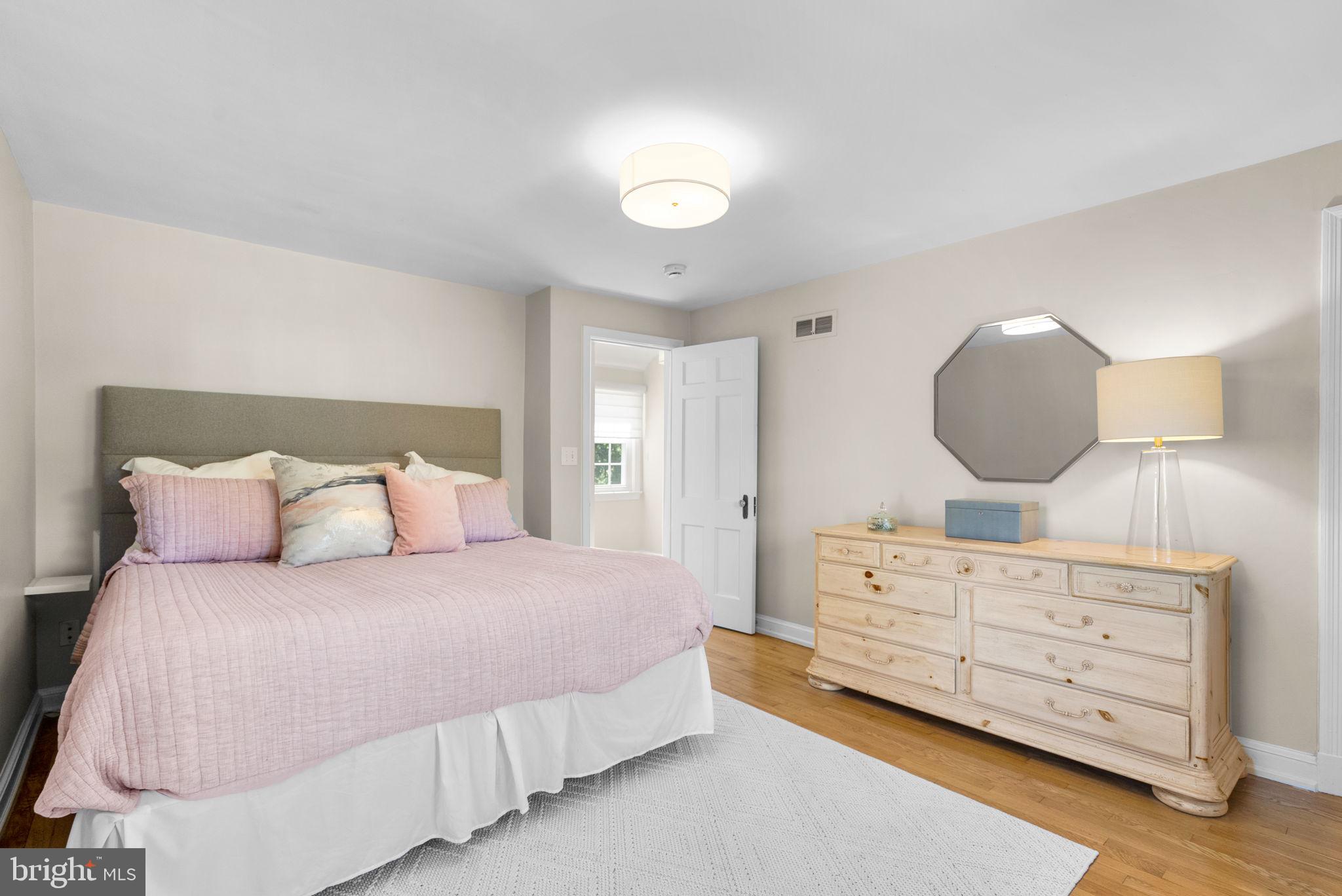 9601 Sutherland Road Silver Spring, MD 20901 - Photo 21 of 48 a bedroom with a bed and a dresser