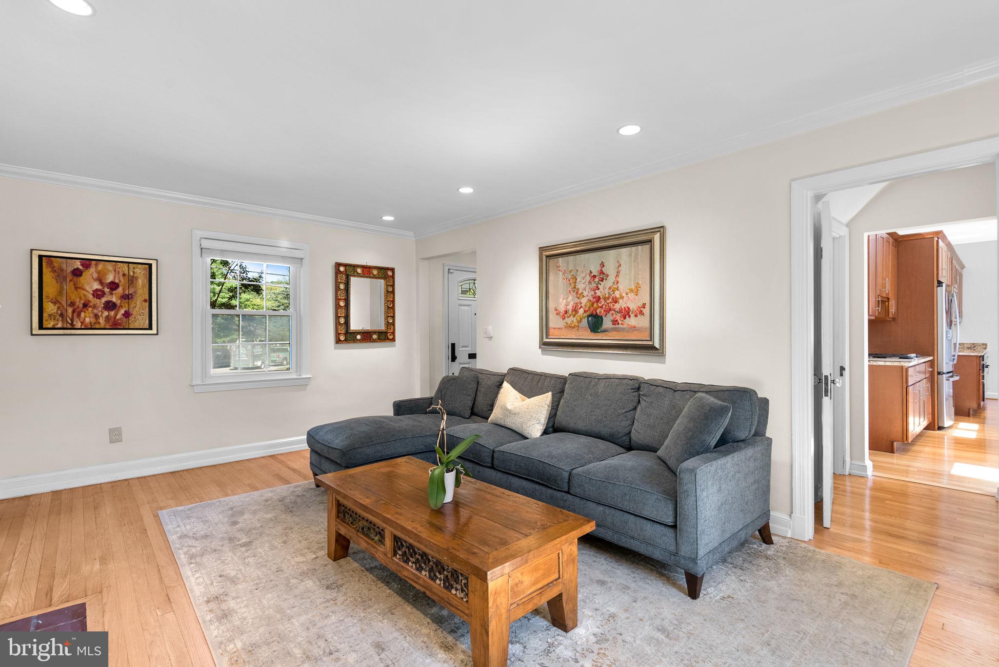 9601 Sutherland Road Silver Spring, MD 20901 - Photo 5 of 48 a living room with furniture and a rug