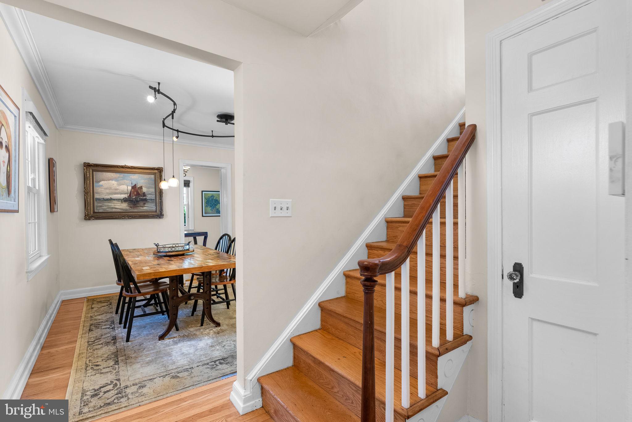9601 Sutherland Road Silver Spring, MD 20901 - Photo 7 of 48 a dining room with wooden floor and a rug