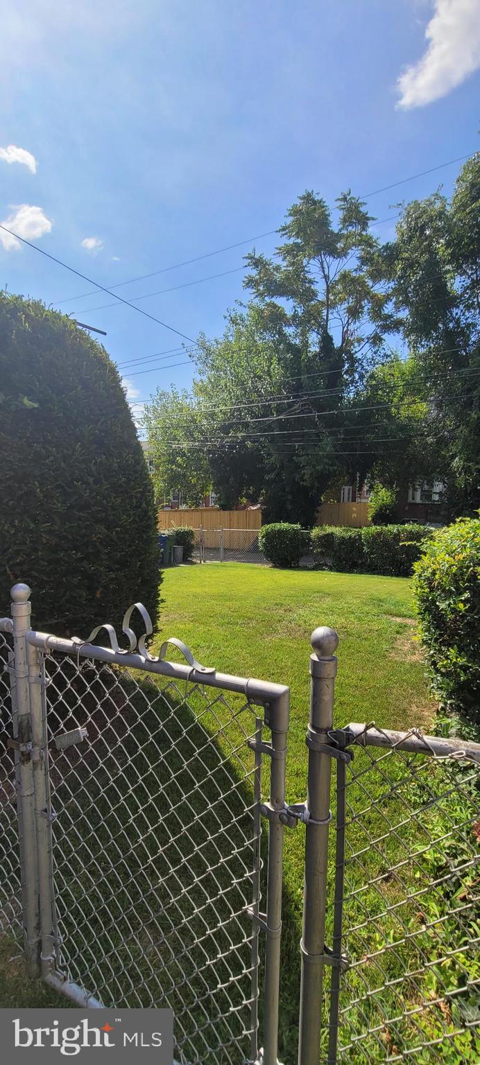 1565 Stonewood Road Baltimore, MD 21239 - Photo 37 of 43 Fenced Backyard