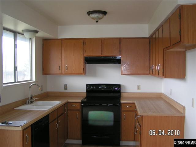 3450 Canvasback Lane Reno, NV 89508 - Photo 2 of 6 a kitchen with a sink and cabinets