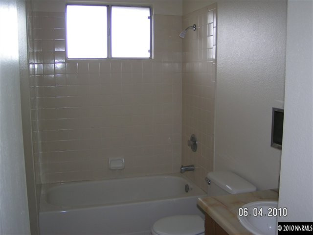 3450 Canvasback Lane Reno, NV 89508 - Photo 4 of 6 a bathroom with a shower and a toilet