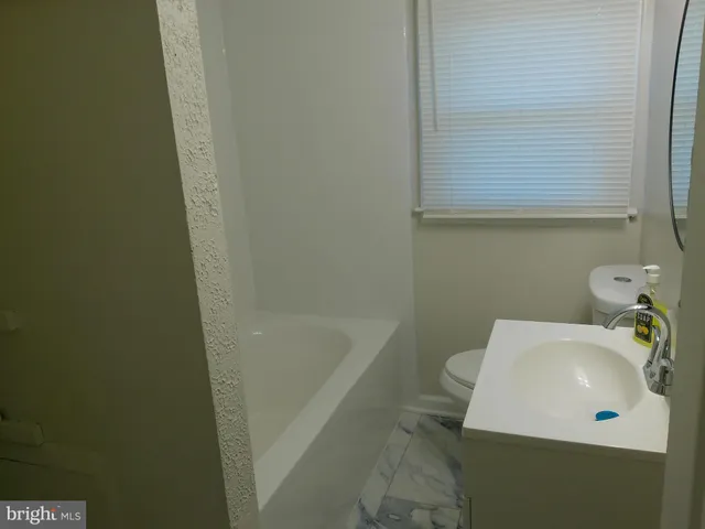a bathroom with a sink and a bathtub