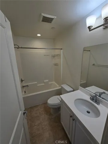 a bathroom with a sink toilet tub and shower