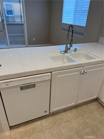 a close view of a sink and a vanity in the cabinet
