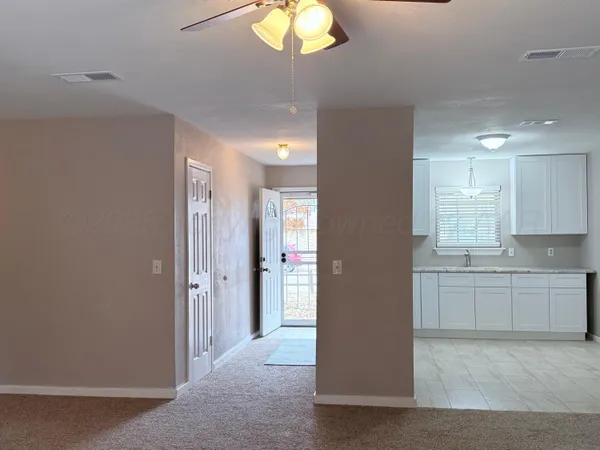 a view of a kitchen and a window