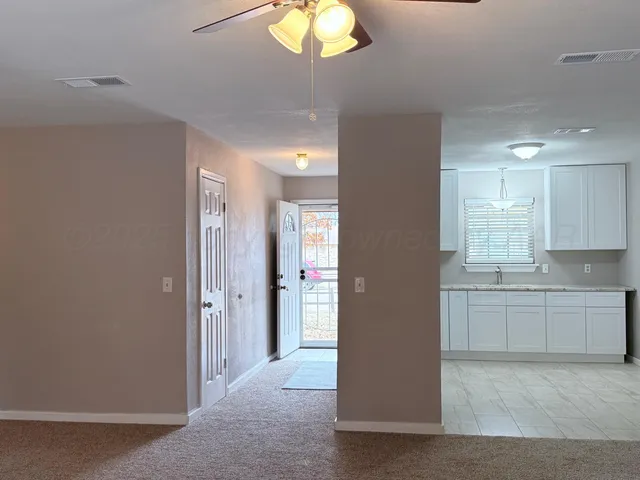 a view of a kitchen and a window
