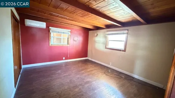 an empty room with windows