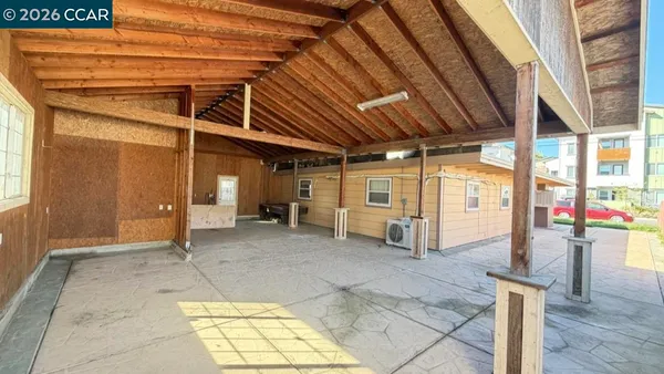 a view of a backyard with wooden fence