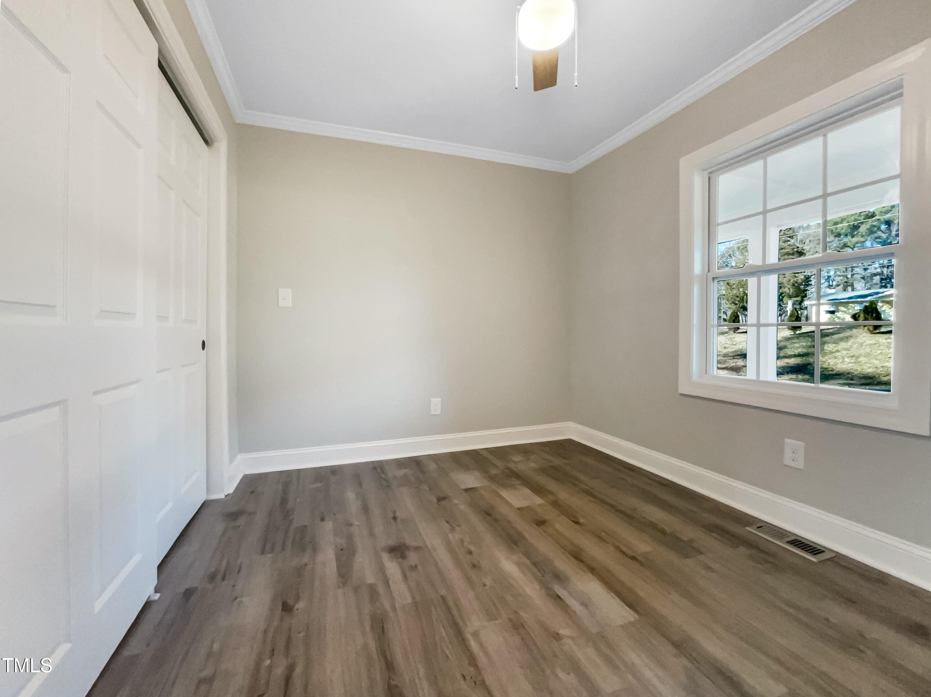 6307 Tryon Road Cary, NC 27518 - Photo 14 of 18 wooden floor in an empty room with a window