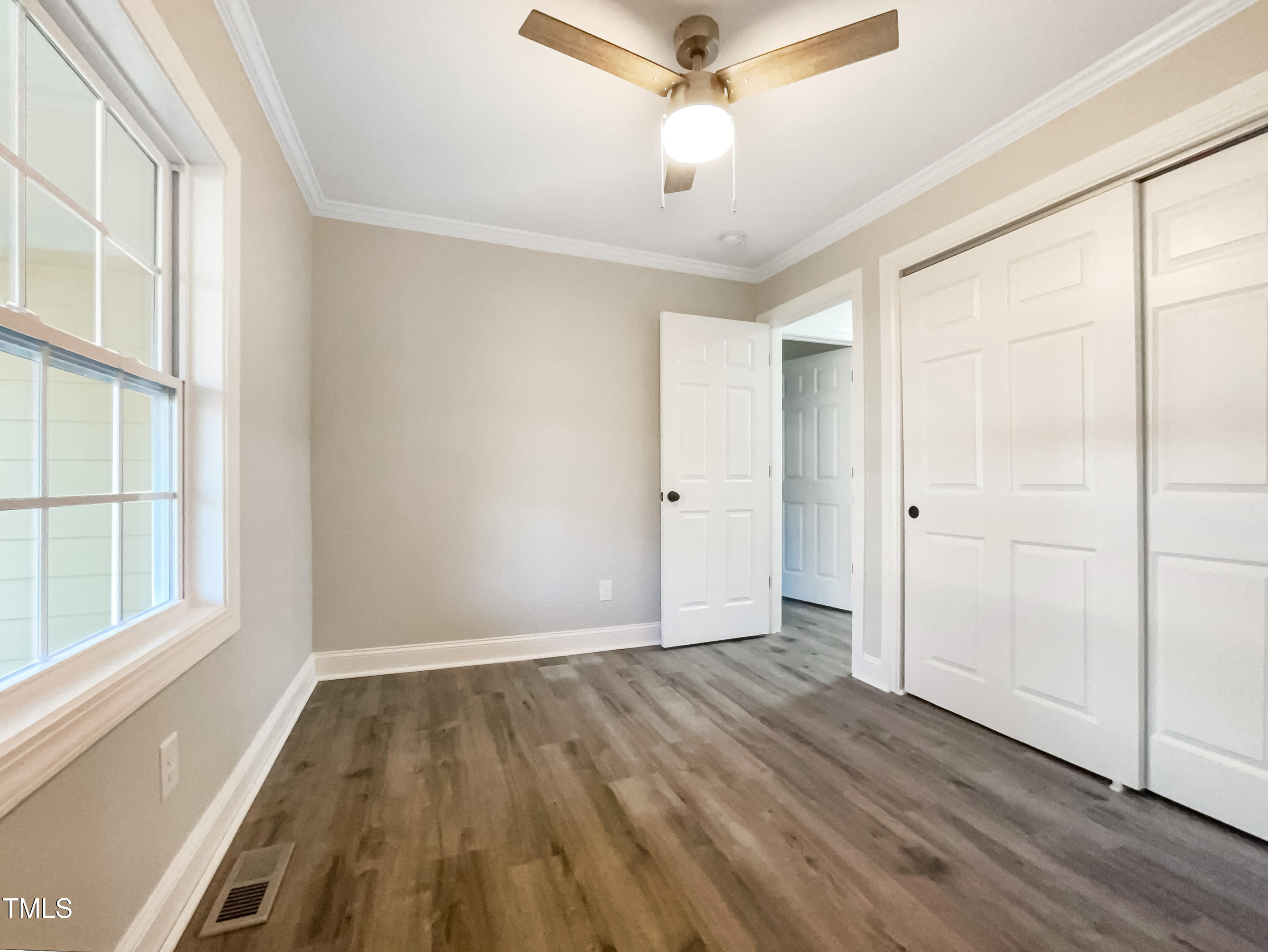 6307 Tryon Road Cary, NC 27518 - Photo 15 of 18 wooden floor in an empty room with a window